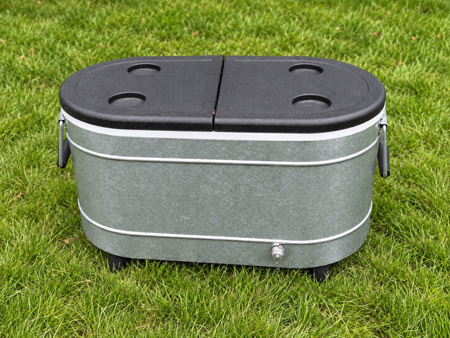 Bongo metal cooler with dark lid on the grass